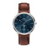 Daniel Wellington watch with brown leather strap and blue dial on white background