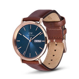Watch with brown leather strap and blue dial on a white background