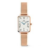 Rose gold watch with a white face and blue second hand on a white background