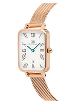 Rose gold watch with a white face and blue hands on a white background