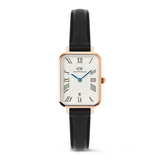 Watch with black strap and rose gold case on a white background