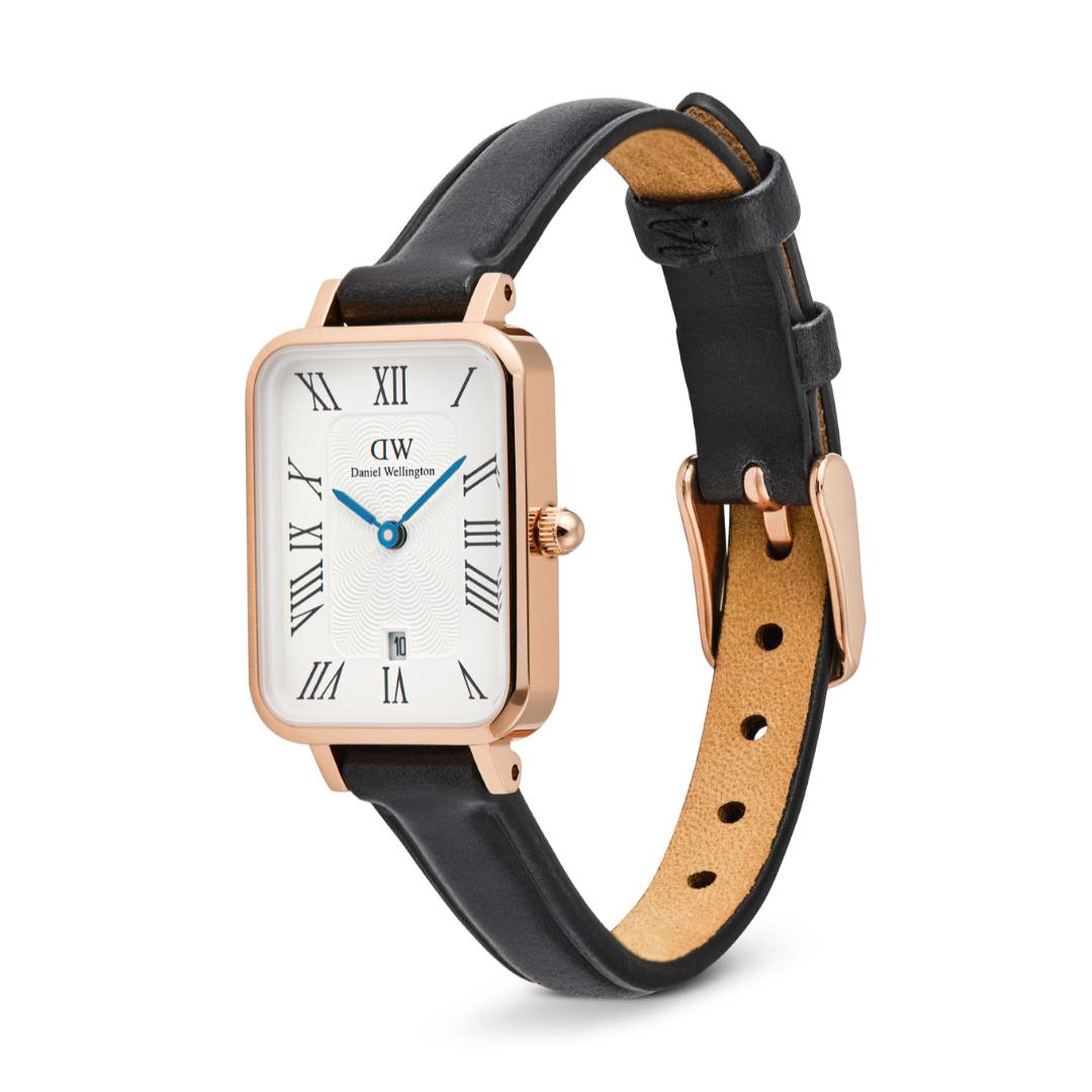 Watch with black leather strap and rose gold case on white background