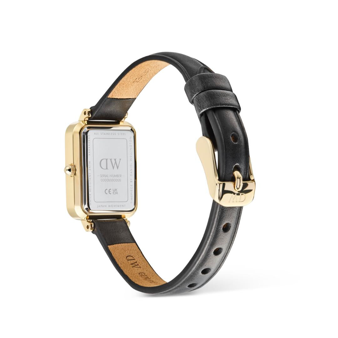 Watch with black leather strap and gold case on a white background