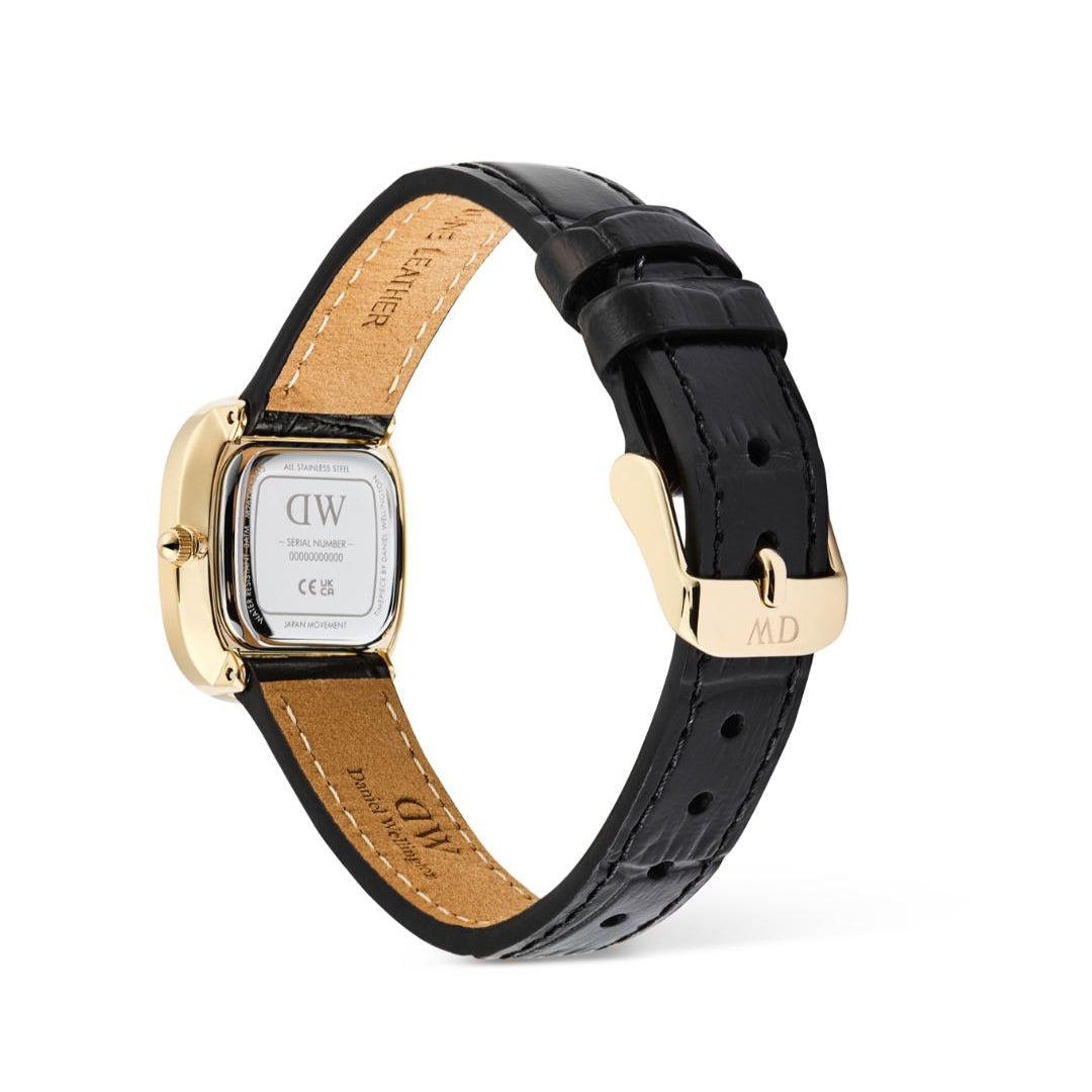 Watch with black leather strap and gold case on a white background