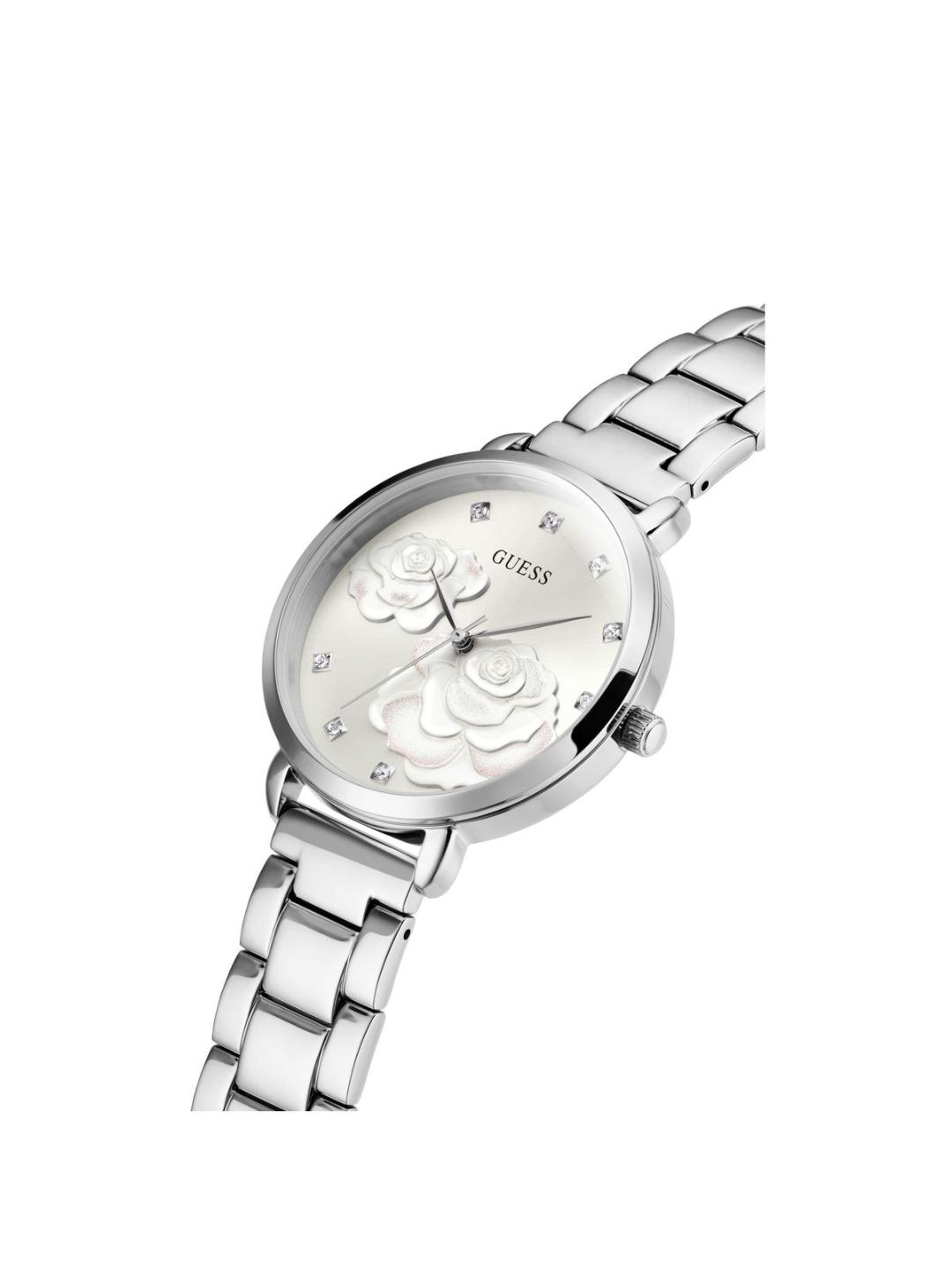Silver watch with floral design on the dial against a white background