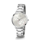 Silver watch with floral design on a white background