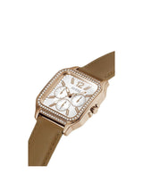 Guess watch with rose gold case and brown leather strap on a white background