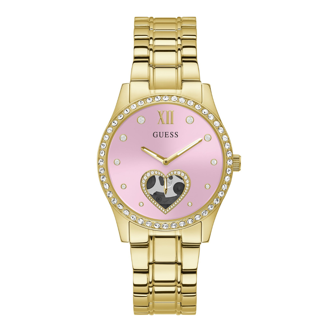 Gold-tone Guess watch with a pink dial, crystal-studded bezel, and a heart-shaped black-and-white pattern detail on the lower half of the face.