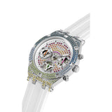 A luxury Guess wristwatch featuring a silver-tone case encrusted with multicolor rhinestones, a skeleton dial with colorful mechanical gears, and a translucent white silicone strap, shown on a white background.