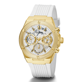 A GUESS men's watch featuring a gold-tone case, a white dial with three subdials, and a white textured silicone strap, shown on a clean white background.