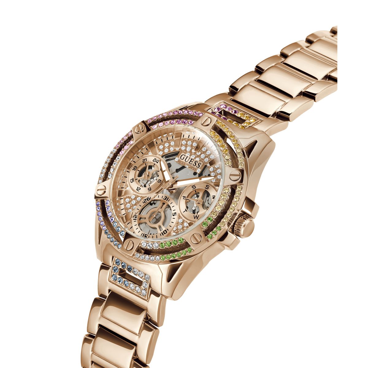 A rose gold Guess wristwatch with a multi-colored crystal bezel and a skeleton dial, shown on a plain white background.