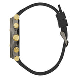 A side profile view of a watch with a black strap, a dark gray case, and prominent gold-tone buttons and lugs, shown against a plain white background.
