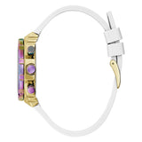 A side profile view of a watch with a white strap, a gold-toned case, and a colorful iridescent bezel with purple accents, set against a plain white background.
