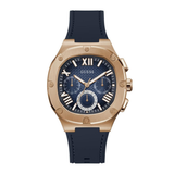 Guess watch with rose gold case, blue strap, and dark blue face on a white background