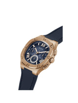 GUESS watch with rose gold case and blue strap on white background