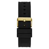 A black silicone watch strap with a polished gold buckle, shown vertically against a plain white background.