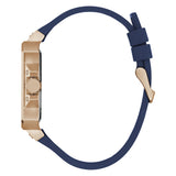 A women's watch with a rectangular rose gold case and a thick navy blue silicone strap, shown from a side profile view on a white background.