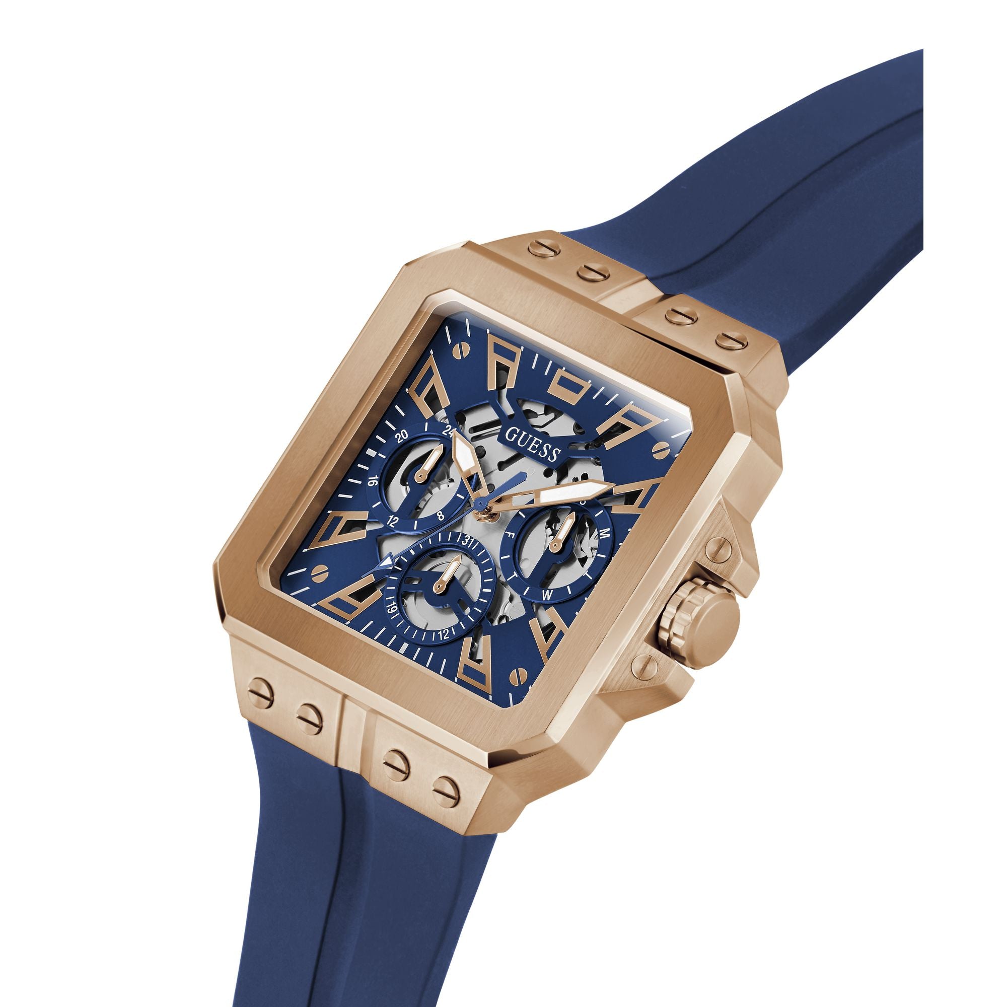 A Guess men's watch featuring a square rose gold case, a blue dial with three subdials, and a blue silicone strap, shown on a white background.