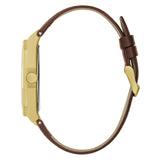Gold watch case with brown leather strap on a white background