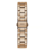 A rose gold metal link bracelet watch by Guess, shown vertically against a solid white background.