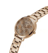 A rose gold women's watch with a textured, glittery dial featuring floral motifs and a matching rose gold metal link bracelet, shown on a plain white background.