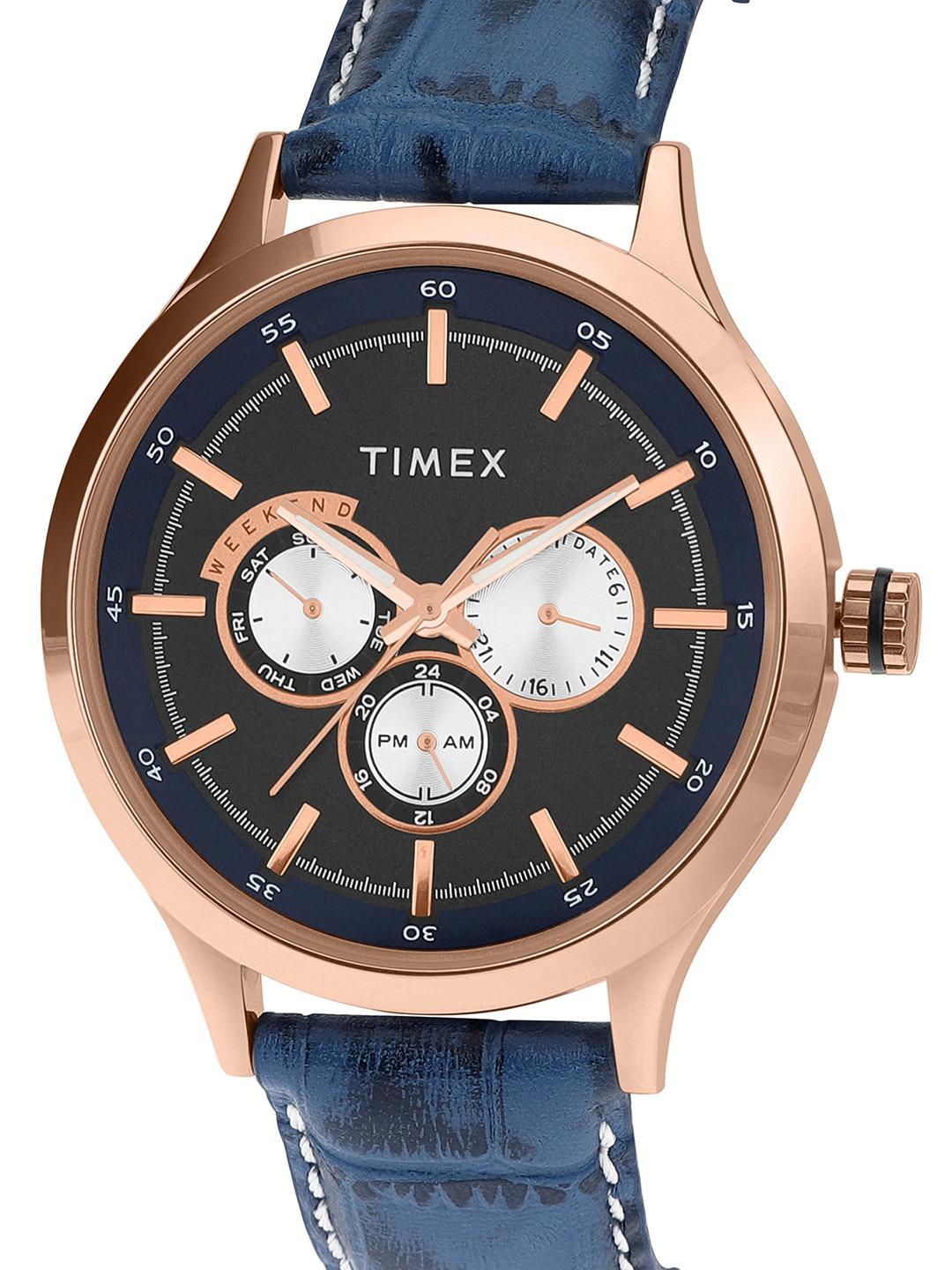 Timex watch with blue strap and rose gold case on white background