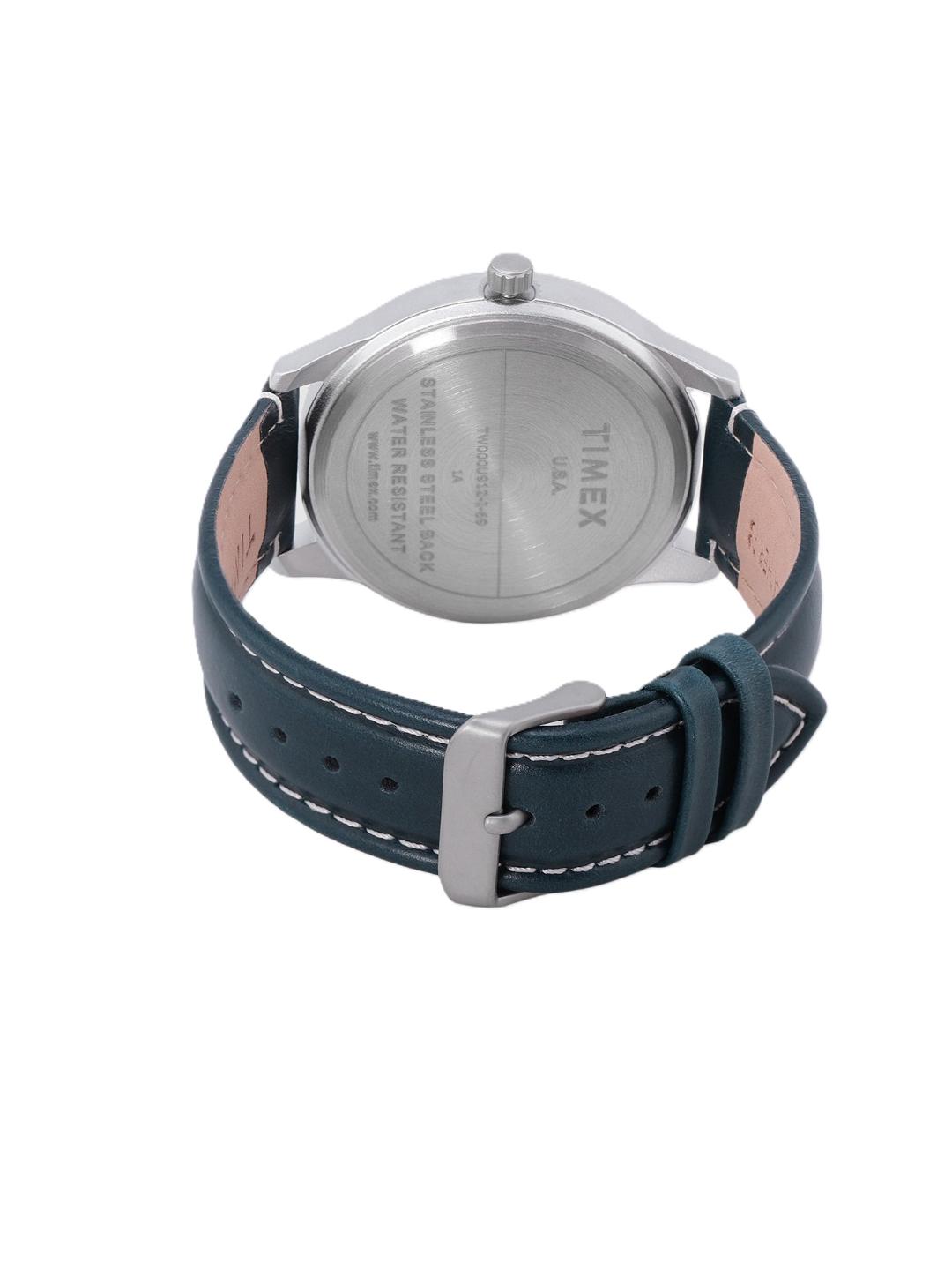 Watch with blue strap and silver case on a white background