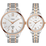 Two Timex watches with silver and rose gold straps on a white background