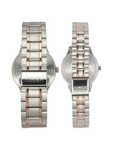 Two Timex watches with silver and rose gold metal bands on a white background
