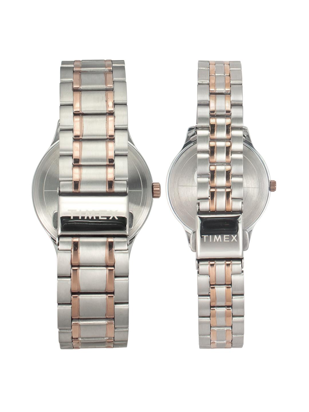 Two Timex watches with silver and rose gold metal bands on a white background
