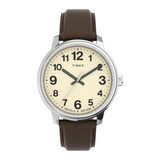 A Timex analog watch with a brown leather strap, a silver-toned metal case, and a cream-colored dial with black Arabic numerals.