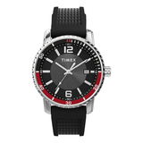 A Timex men's analog watch with a black textured silicone strap, a silver-tone stainless steel case, and a black dial featuring a red inner ring and white markings.