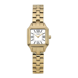 A Timex women's watch with a gold-tone metal link bracelet, a square bezel, and a white dial with black Roman numerals.