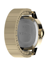 Timex watch shown from the back, featuring a gold-tone metal case and integrated link bracelet with a silver-toned glass backplate.