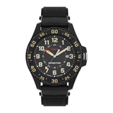 A Timex Expedition wristwatch with a black case, black textured strap, and a black dial featuring beige numerals and markers, with a small orange accent on the hands.