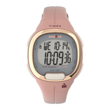 A Timex Ironman digital watch with a dusty pink strap and case, featuring a rose gold bezel and a gray LCD display showing the time as 10:09.