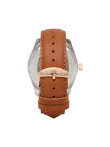Watch with brown leather strap and rose gold accents on a white background