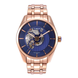 Timex watch with rose gold case and blue face on a white background