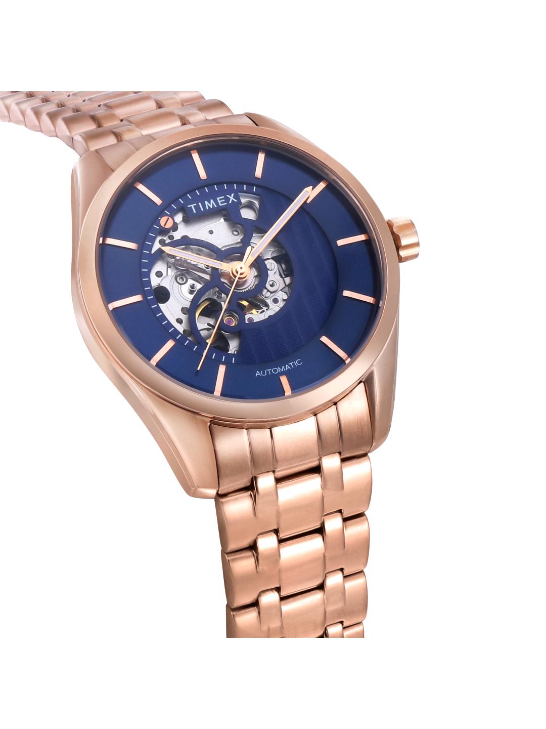 Rose gold watch with blue face on a white background