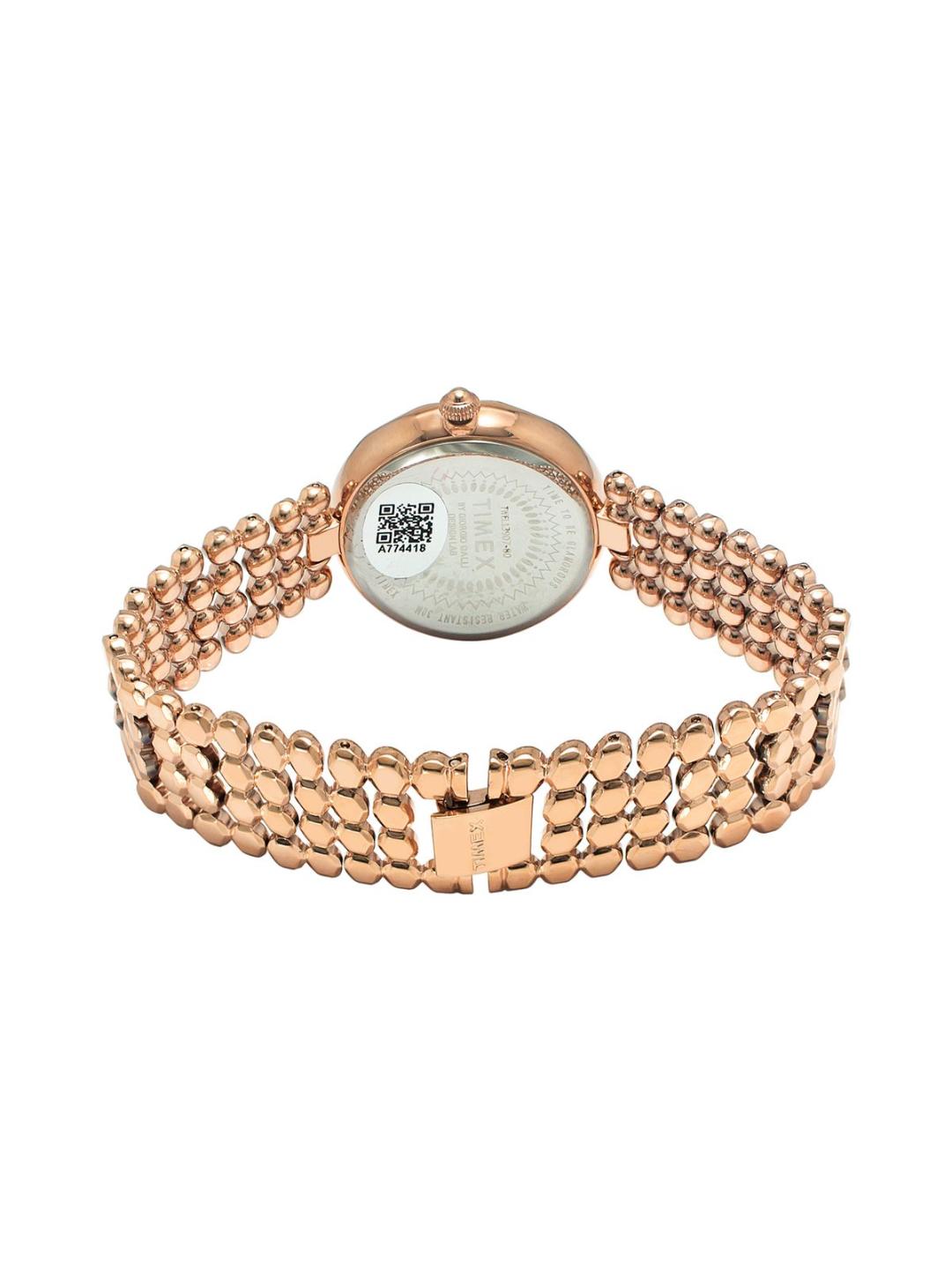 Rose gold watch with a white face on a white background