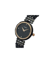 Black wristwatch with gemstone accents on a white background