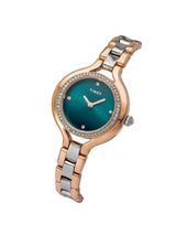 Timex watch with a blue face and rose gold and silver band on a white background