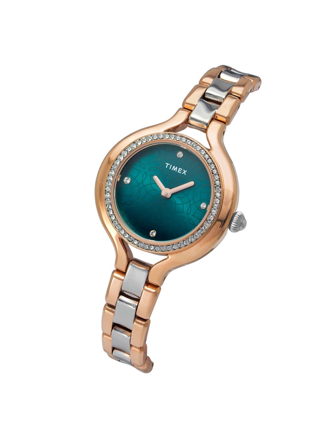 Timex watch with a blue face and rose gold and silver band on a white background
