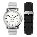 A Timex Indiglo wristwatch with a silver-tone metal case and link bracelet, shown alongside a separate black rubber strap with a silver buckle. The watch features a white dial with black Arabic numerals and hands.