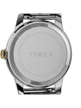 The back of a Timex stainless steel watch, showing the brushed silver case back with the TIMEX logo in the center and a gold-tone crown on the left, set against a plain white background.