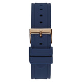 A navy blue silicone watch strap with a polished rose gold buckle, shown vertically against a solid white background.