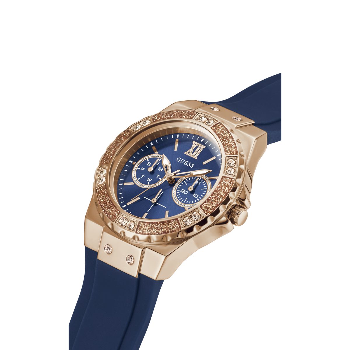 A Guess women's watch featuring a rose gold case, a blue dial with gold-tone subdials and Roman numerals, and a blue silicone strap, shown on a white background.