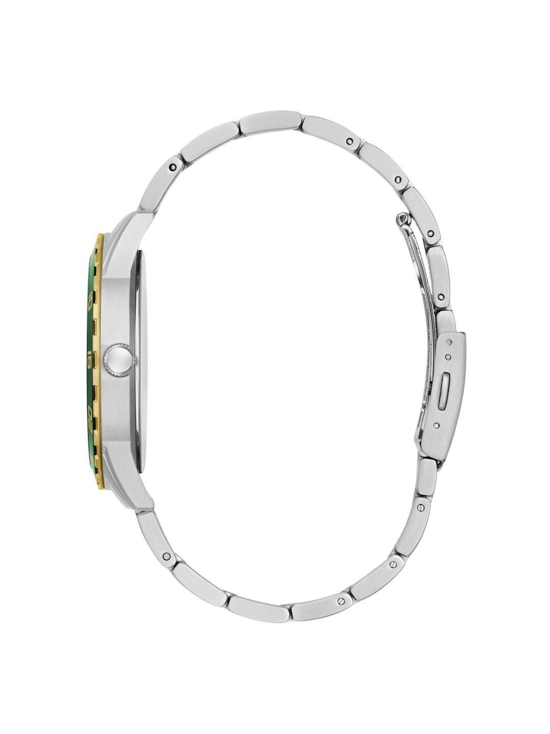 Close-up of a silver watch with green accents on a white background