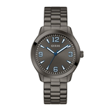 A Guess analog watch with a dark gray metal case and link bracelet, featuring a matching dark gray dial with bright blue hands, numerals, and second hand.