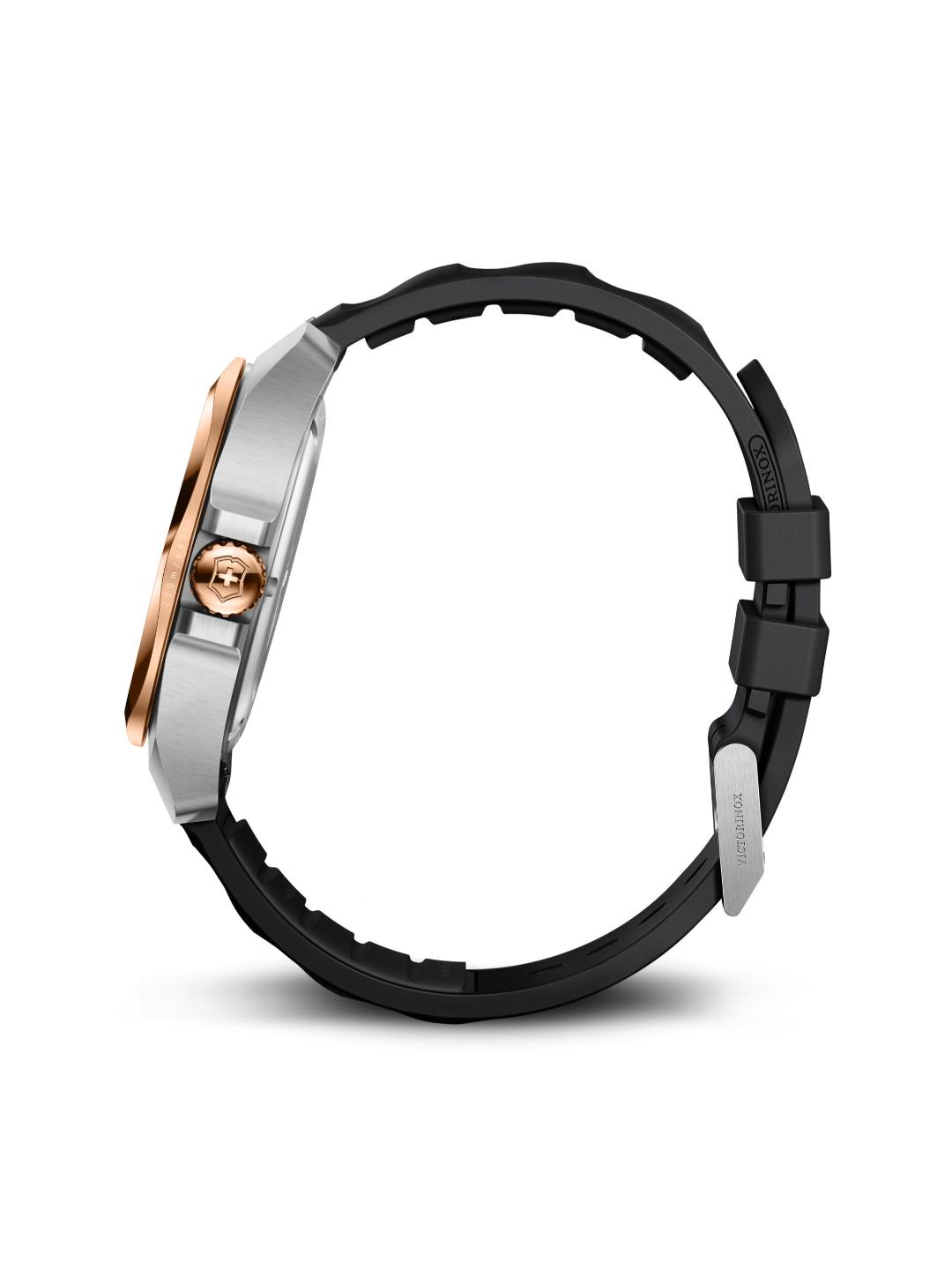 Close-up of a watch with a black band and rose gold accents on a white background